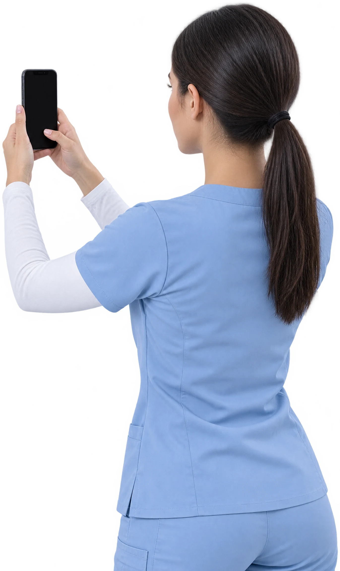 A provider in light blue scrubs seen over the shoulder, holding up an iPhone running Aesthetic Photo Pro
